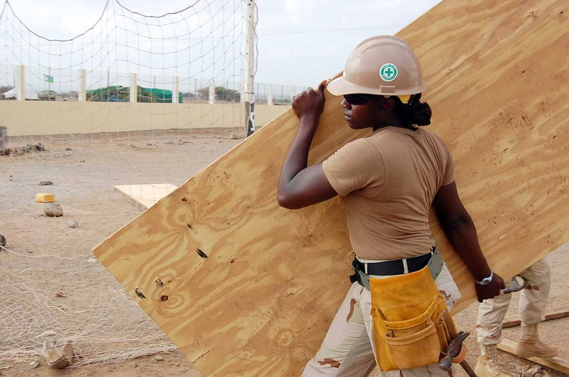 Female workers are carrying spruce splints