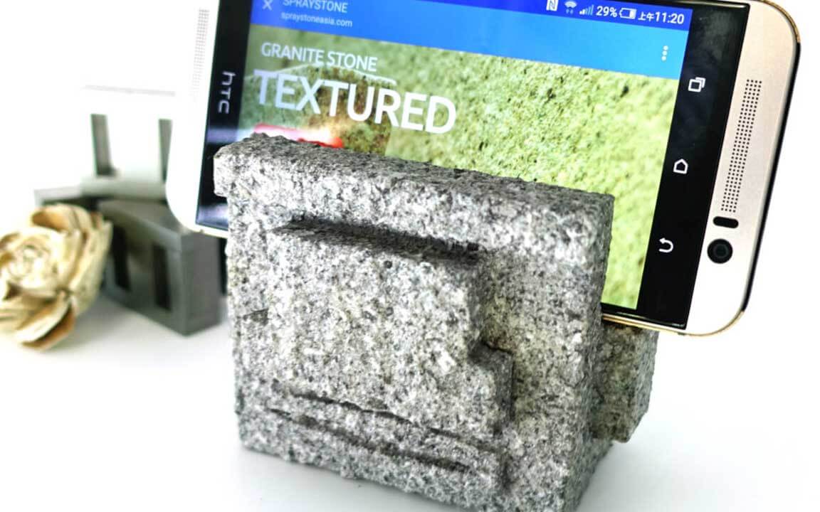 The styrofoam and plastic phone holder, which covered with ADD STONE imitation stone paint, became a granite texture stone carving phone holder.