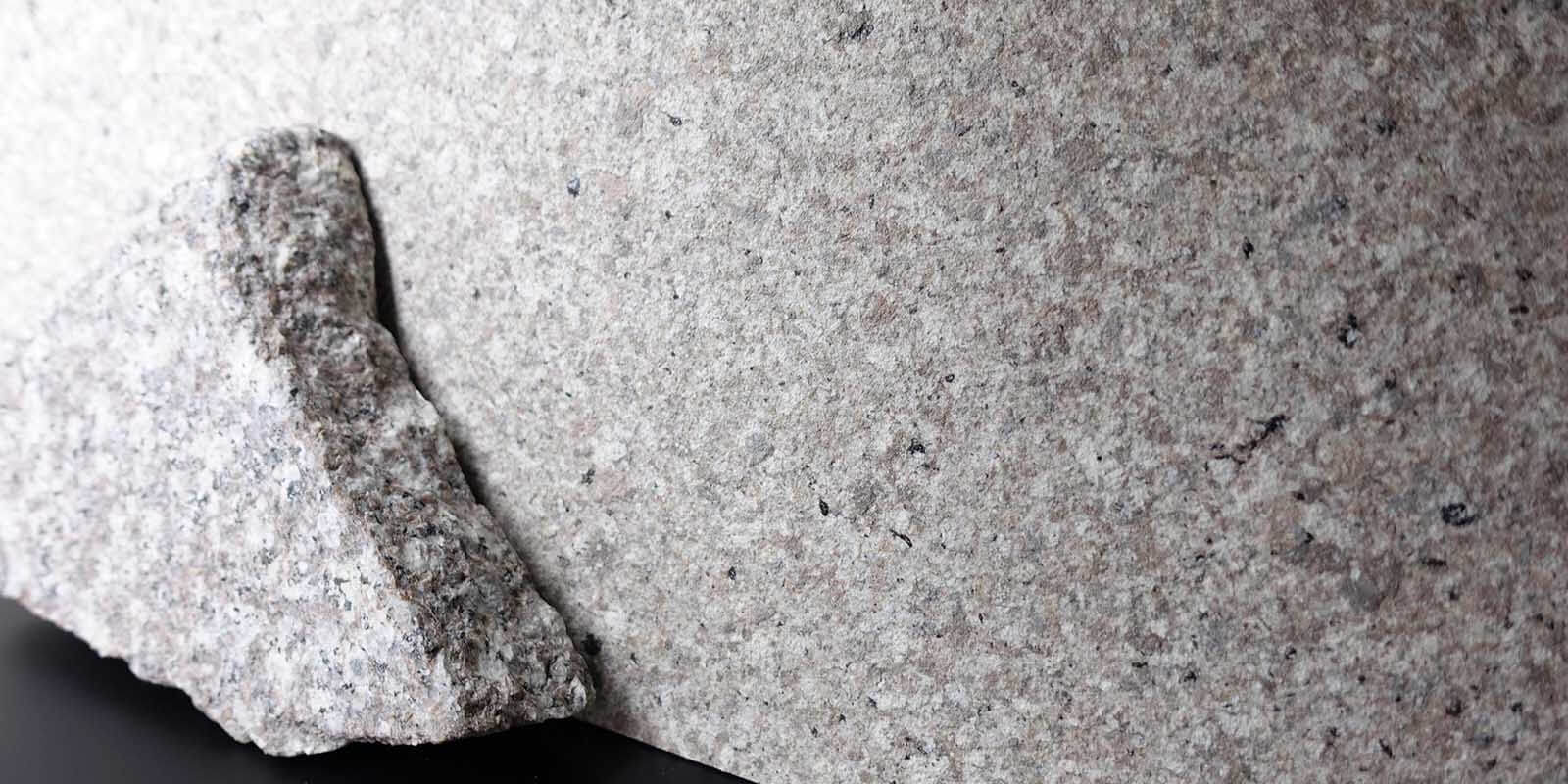 There is no noticeable difference in color and details between faux-stone coating and the actual granite stone