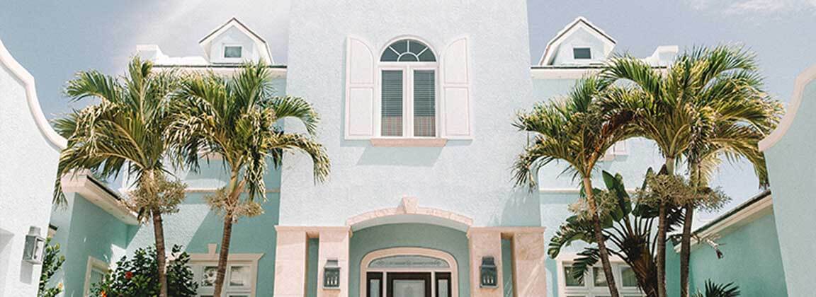 The exterior wall of villa with Gravel Faux-Stone Coating. Pink goes well with sky blue, it expresses the tropical impression of youth.